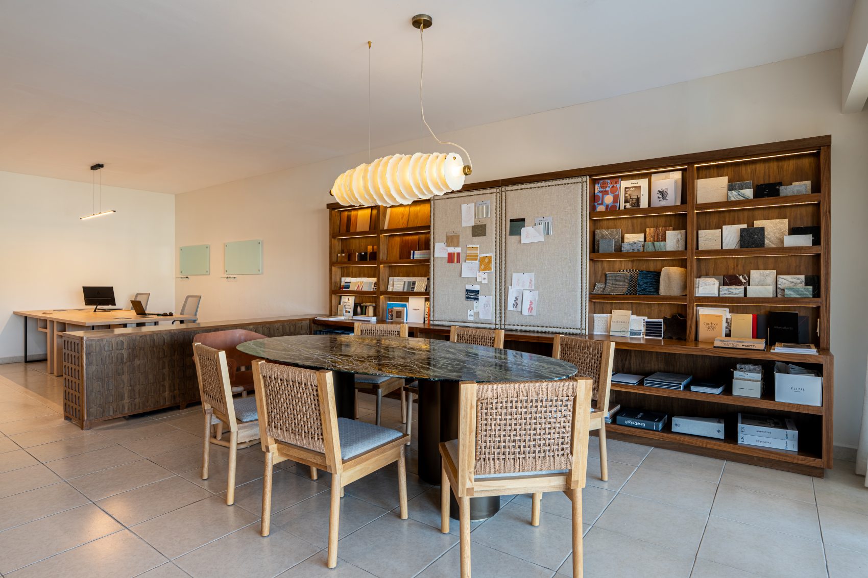 The materials library at the Onoa showroom in San Jose del Cabo, with the meeting table